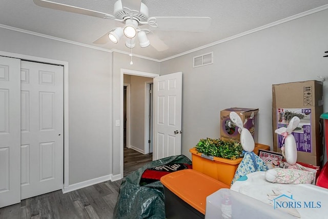5157 Brinthaven Dr, Sylvania, OH 43560 - bedroom with wood finished floors, crown molding, a ceiling fan, a textured ceiling, and a closet