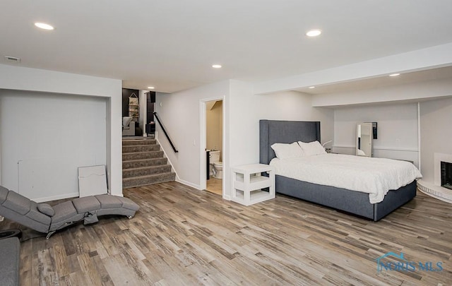 5157 Brinthaven Dr, Sylvania, OH 43560 - bedroom with wood finished floors, recessed lighting, and ensuite bath