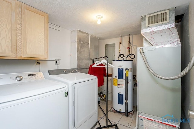 5157 Brinthaven Dr, Sylvania, OH 43560 - laundry area featuring water heater, cabinet space, separate washer and dryer, heating unit, and light tile patterned flooring