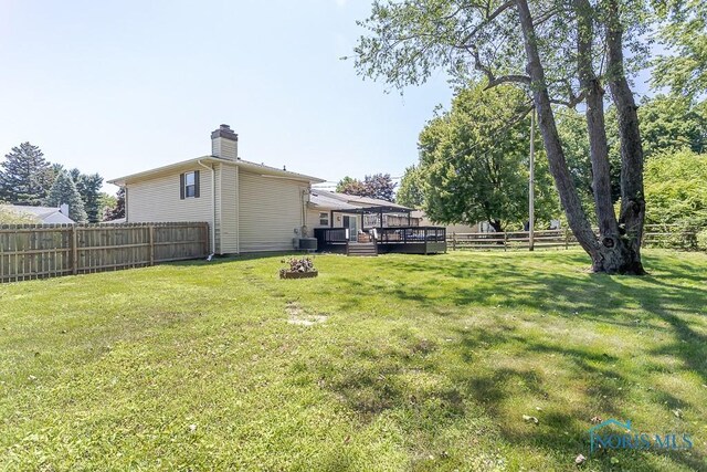 5157 Brinthaven Dr, Sylvania, OH 43560 - fenced backyard featuring a deck