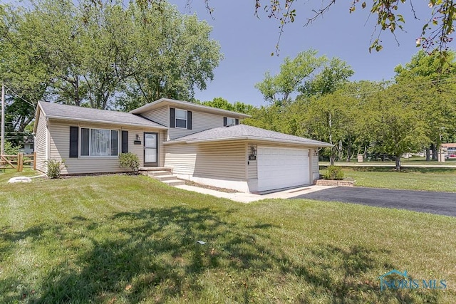 5157 Brinthaven Dr, Sylvania, OH 43560 - tri-level home with a garage, driveway, and a front lawn