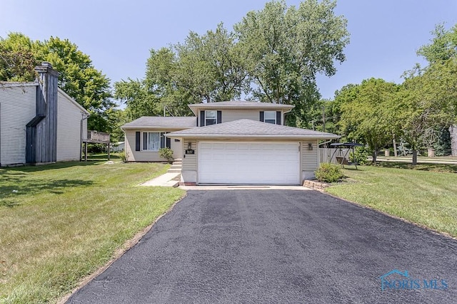 5157 Brinthaven Dr, Sylvania, OH 43560 - split level home with a front lawn and a garage