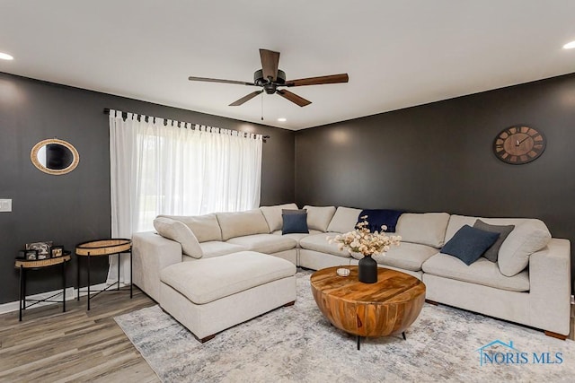 5157 Brinthaven Dr, Sylvania, OH 43560 - living area featuring ceiling fan, wood finished floors, recessed lighting, and an accent wall