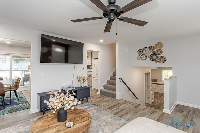 5157 Brinthaven Dr, Sylvania, OH 43560 - living room with ceiling fan, light wood finished floors, recessed lighting, and stairs