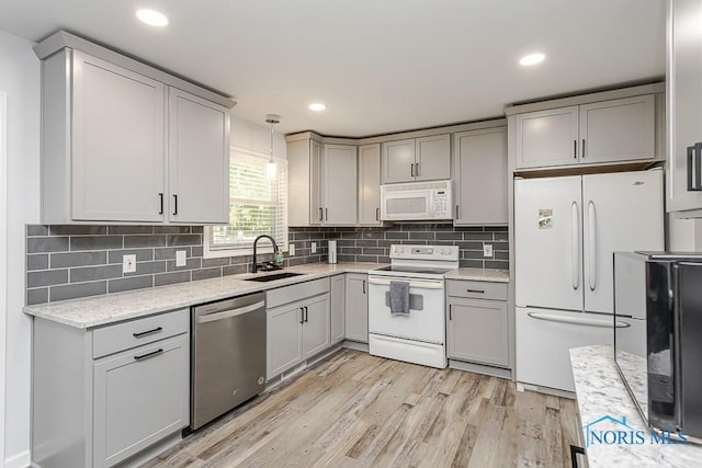 5157 Brinthaven Dr, Sylvania, OH 43560 - kitchen with white appliances, gray cabinetry, light wood-type flooring, and recessed lighting
