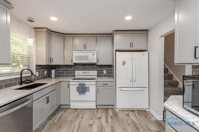 5157 Brinthaven Dr, Sylvania, OH 43560 - kitchen with white appliances, gray cabinets, light wood-style floors, decorative backsplash, and recessed lighting