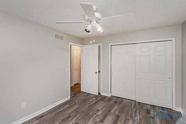5157 Brinthaven Dr, Sylvania, OH 43560 - unfurnished bedroom with wood finished floors, a closet, a textured ceiling, and ceiling fan