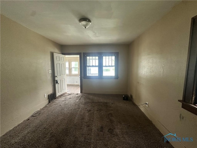 1749 Berdan Ave, Toledo, OH 43613 - empty room featuring carpet floors and a textured wall
