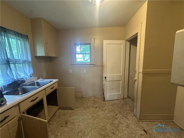 1749 Berdan Ave, Toledo, OH 43613 - kitchen featuring a sink and light countertops