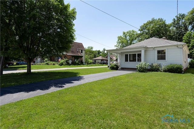 3328 Island Ave, Toledo, OH 43614 - view of front of property with a front yard and driveway