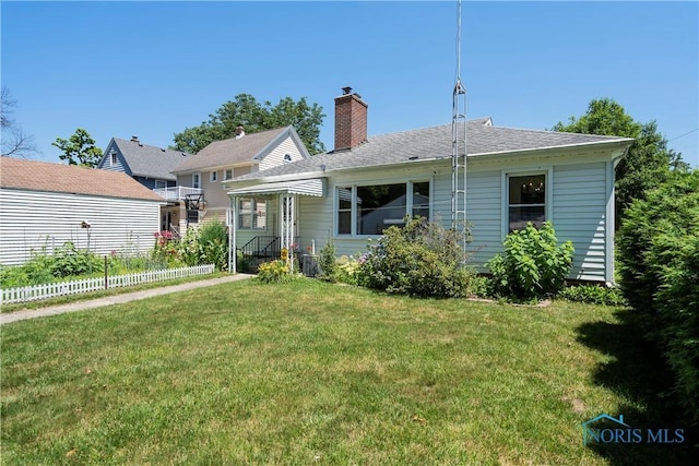 3328 Island Ave, Toledo, OH 43614 - back of property featuring a chimney and a shingled roof