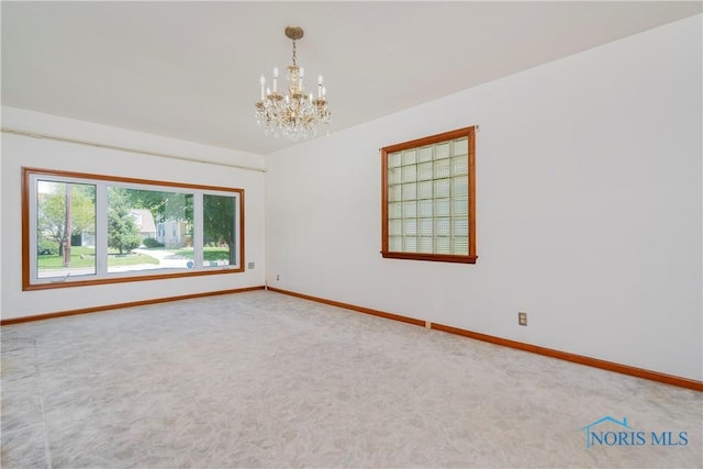 3328 Island Ave, Toledo, OH 43614 - unfurnished room with a chandelier and carpet