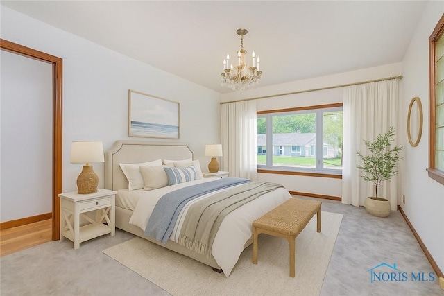 3328 Island Ave, Toledo, OH 43614 - bedroom with a chandelier and light colored carpet