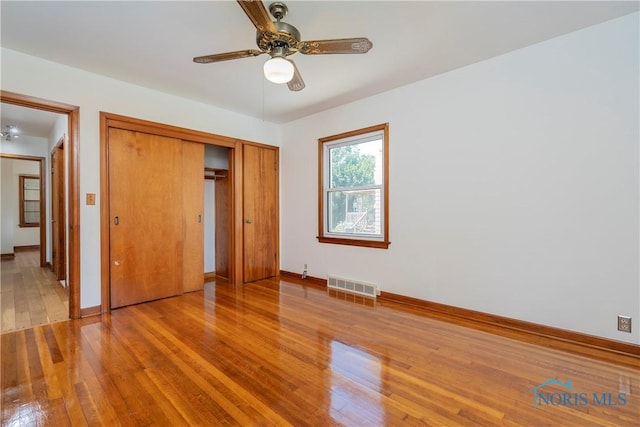 3328 Island Ave, Toledo, OH 43614 - unfurnished bedroom featuring light wood-type flooring, a closet, and a ceiling fan
