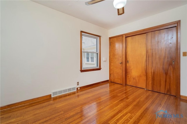 3328 Island Ave, Toledo, OH 43614 - unfurnished bedroom featuring wood finished floors, a closet, and ceiling fan