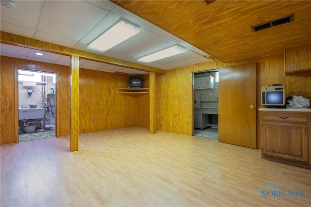 3328 Island Ave, Toledo, OH 43614 - below grade area with light wood-style floors and wooden walls
