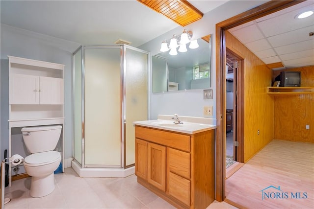 3328 Island Ave, Toledo, OH 43614 - bathroom with vanity, a shower stall, and wooden walls