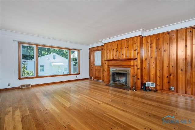 3328 Island Ave, Toledo, OH 43614 - unfurnished living room with wood-type flooring, a fireplace with flush hearth, and crown molding