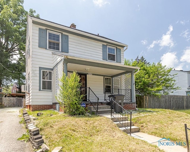 2529 Greenbriar Rd, Toledo, OH 43607 - view of front of property with covered porch and a chimney