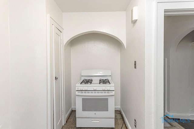 2529 Greenbriar Rd, Toledo, OH 43607 - kitchen featuring white range with gas cooktop and arched walkways