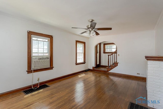 2529 Greenbriar Rd, Toledo, OH 43607 - unfurnished room with arched walkways, wood-type flooring, cooling unit, crown molding, and a ceiling fan