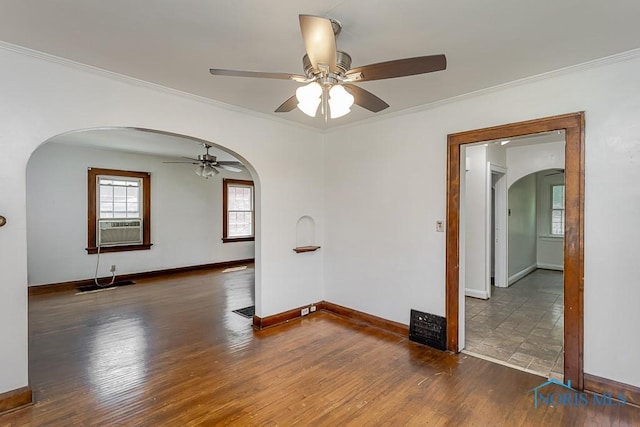 2529 Greenbriar Rd, Toledo, OH 43607 - empty room with arched walkways, a ceiling fan, ornamental molding, hardwood / wood-style flooring, and cooling unit