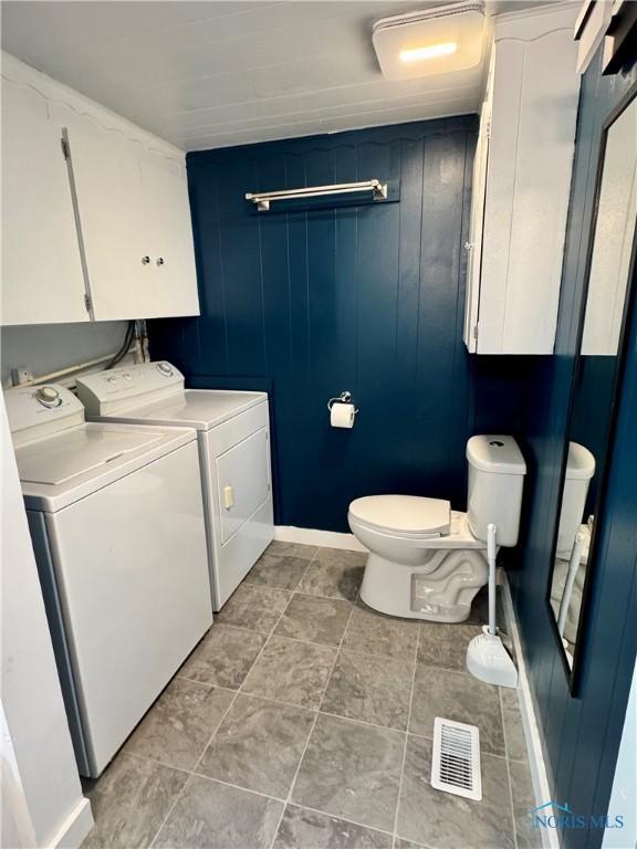 26110 Elizabeth St, Defiance, OH 43512 - bathroom featuring washing machine and clothes dryer and toilet