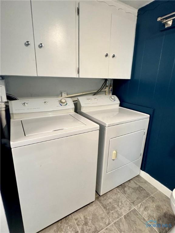 26110 Elizabeth St, Defiance, OH 43512 - laundry area with separate washer and dryer and baseboards