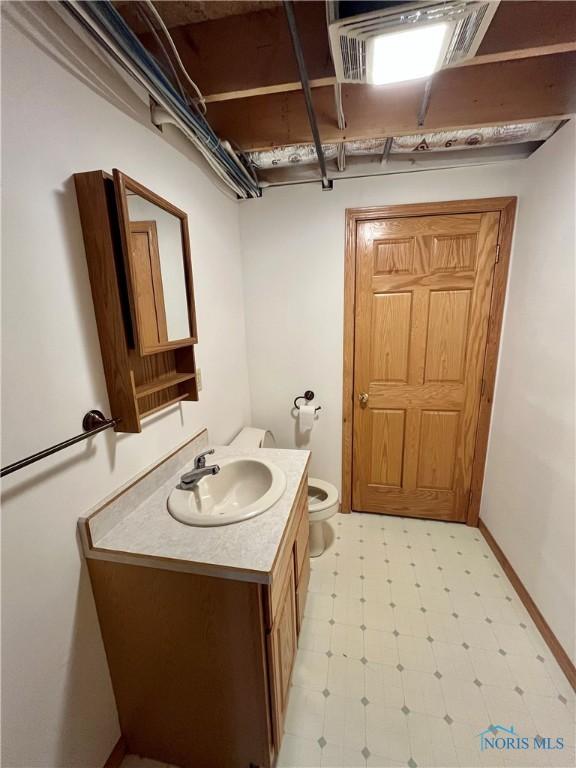 13362 Road 27C, Antwerp, OH 45813 - half bathroom featuring vanity and tile patterned floors