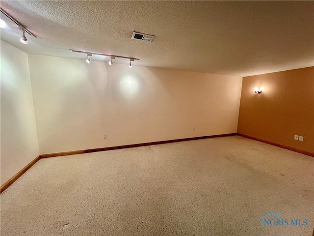 13362 Road 27C, Antwerp, OH 45813 - carpeted spare room featuring track lighting and a textured ceiling
