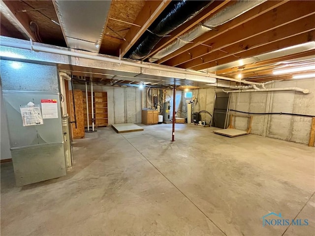 13362 Road 27C, Antwerp, OH 45813 - unfinished basement with electric water heater and heating unit