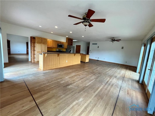 13362 Road 27C, Antwerp, OH 45813 - kitchen featuring stainless steel appliances, ceiling fan, a kitchen breakfast bar, open shelves, and recessed lighting