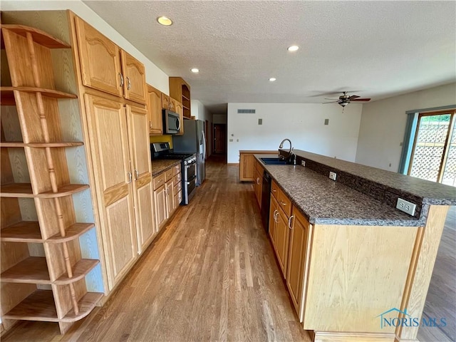 13362 Road 27C, Antwerp, OH 45813 - kitchen featuring stainless steel appliances, light wood-style floors, ceiling fan, a large island, and open shelves
