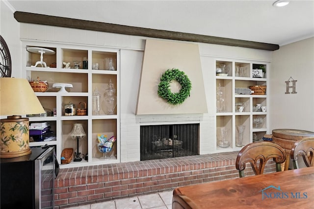 4567 Torquay Ave, Toledo, OH 43615 - tiled living area featuring a brick fireplace