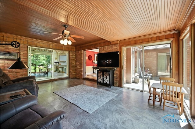 4567 Torquay Ave, Toledo, OH 43615 - living area featuring wood ceiling, wooden walls, a ceiling fan, and ornamental molding