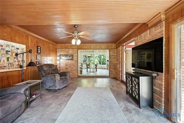 4567 Torquay Ave, Toledo, OH 43615 - living room with wood ceiling, a ceiling fan, and wooden walls