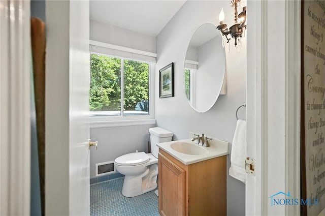 4567 Torquay Ave, Toledo, OH 43615 - bathroom with vanity, tile patterned flooring, and a chandelier
