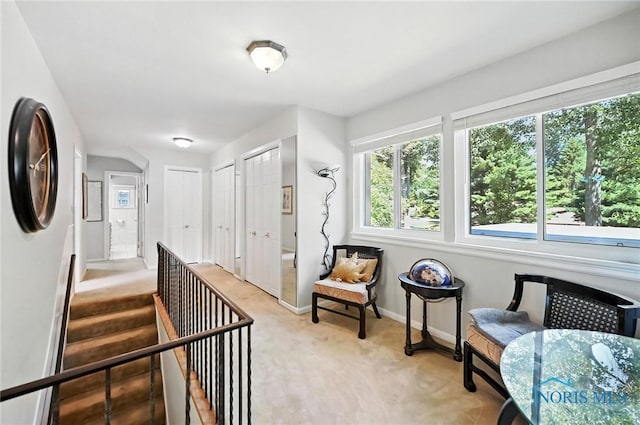 4567 Torquay Ave, Toledo, OH 43615 - hallway with light colored carpet and an upstairs landing