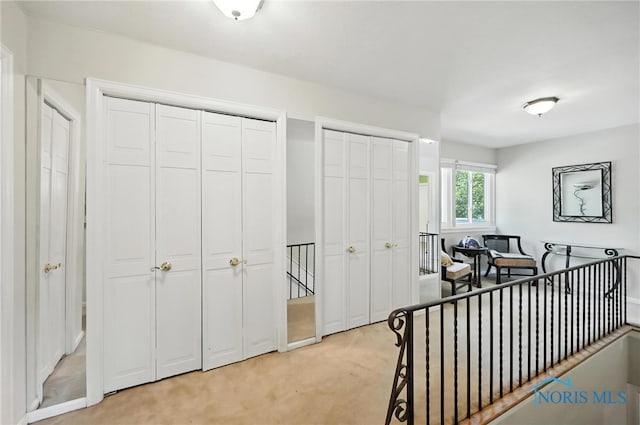 4567 Torquay Ave, Toledo, OH 43615 - corridor with an upstairs landing and light colored carpet