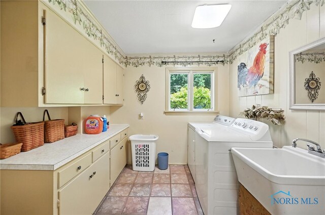 4567 Torquay Ave, Toledo, OH 43615 - laundry room featuring cabinet space and independent washer and dryer