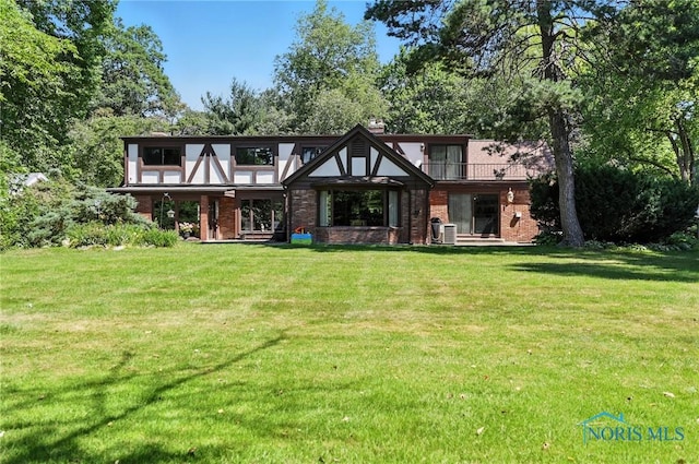 4567 Torquay Ave, Toledo, OH 43615 - english style home with brick siding and a front yard