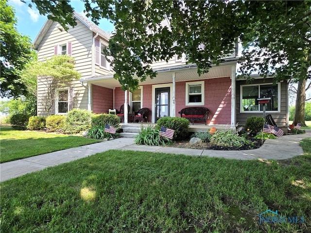 12406 Cross Creek Rd, Bowling Green, OH 43402 - view of front of home with covered porch and a front lawn