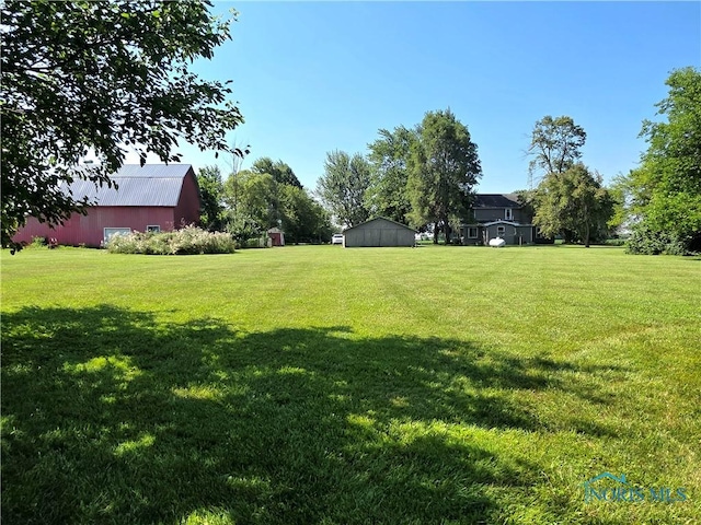 12406 Cross Creek Rd, Bowling Green, OH 43402 - view of green lawn with an outdoor structure