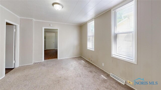 1534 Pinewood Ave, Toledo, OH 43607 - carpeted spare room featuring crown molding