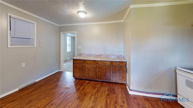 1534 Pinewood Ave, Toledo, OH 43607 - kitchen featuring crown molding, white electric range oven, brown cabinets, light countertops, and dark wood-style flooring