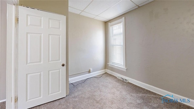 1534 Pinewood Ave, Toledo, OH 43607 - carpeted spare room with a paneled ceiling and baseboards
