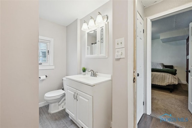 1285 Glenview Rd, Toledo, OH 43614 - bathroom featuring vanity, wood finished floors, and ensuite bath