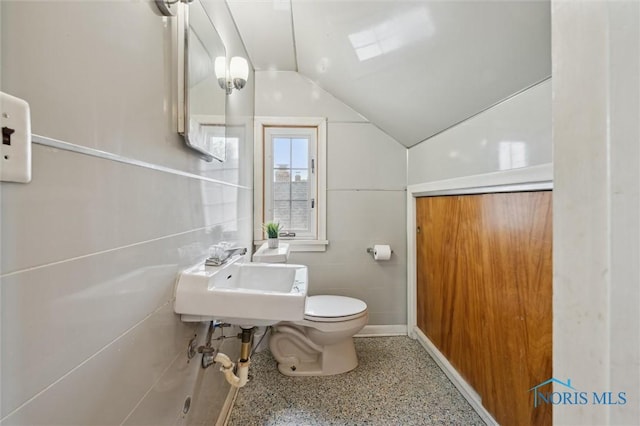 1285 Glenview Rd, Toledo, OH 43614 - half bathroom with speckle patterned floor and vaulted ceiling