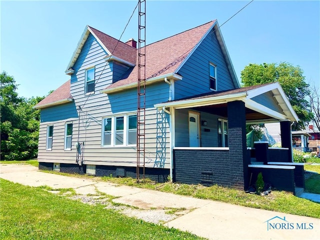 3927 Vermaas Ave, Toledo, OH 43612 - view of property exterior with a porch and roof with shingles