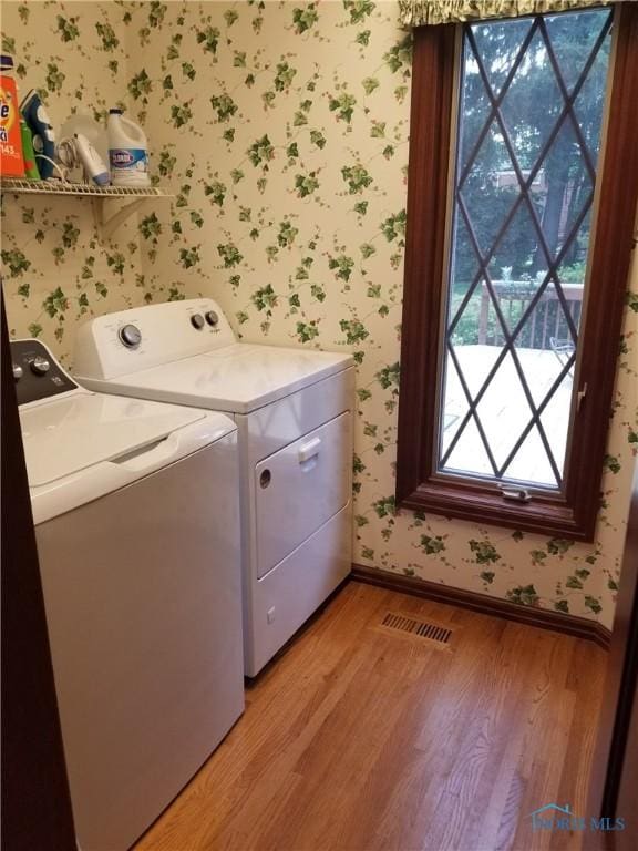 3704 Brookside Rd, Ottawa Hills, OH 43606 - laundry room featuring wallpapered walls, independent washer and dryer, and light wood finished floors